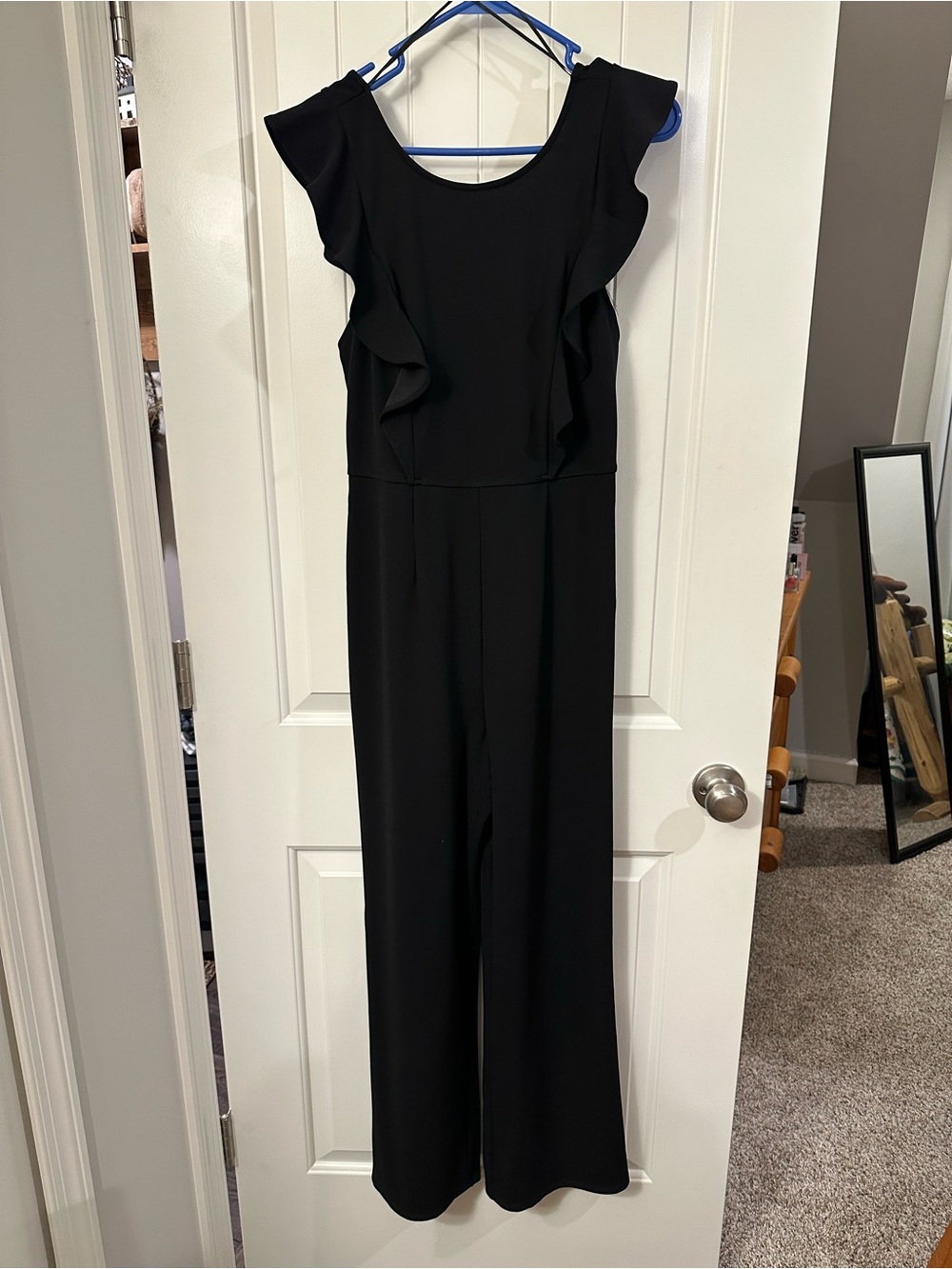 Francesca's Collections Black Ruffle-Shoulder Jumpsuit